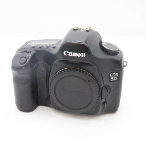A Canon EOS 5D digital camera body without a lens.