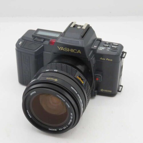 A Yashica SLR camera with an auto-focus lens and several control dials on the body.