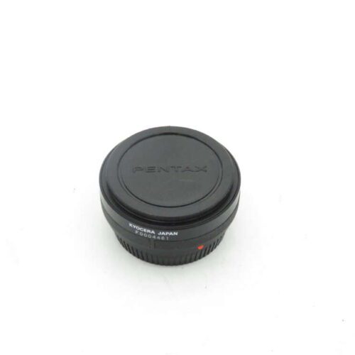 Pentax camera lens cap with "KYOCERA JAPAN" inscribed.