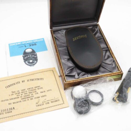 Sekonic Studio Deluxe L-398 light meter kit with case, certificate of authenticity, accessories, and manual.