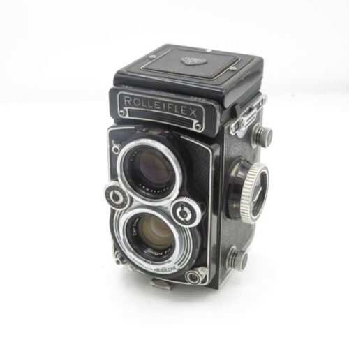 Vintage Rolleiflex twin-lens reflex camera with a black and silver design.