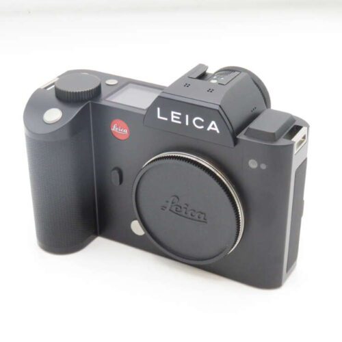 A black Leica camera body with a lens cap displaying the Leica logo.
