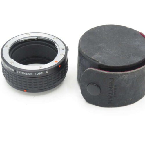 Pentax Helicoid Extension Tube K with a black, cylindrical leather case.