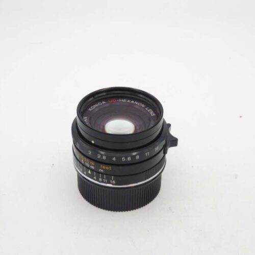 Konica UC-Hexanon lens with f/2.8 aperture and focus markings on white background.