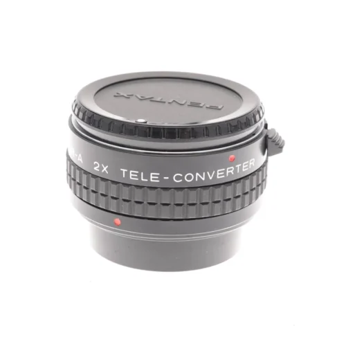 Pentax 2X tele-converter lens with lens caps.