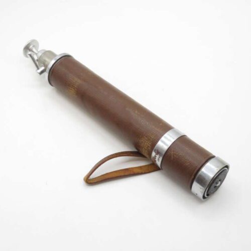 Vintage brown handheld air pump with silver fittings and a small leather loop.