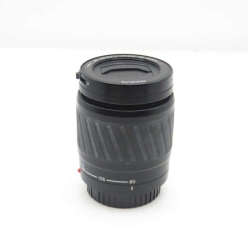 Black Minolta camera lens with a focal range of 80-135mm.
