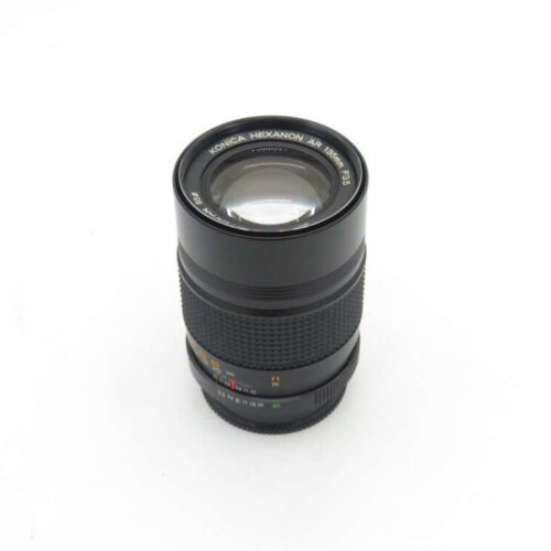 Konica Hexanon AR 135mm F3.5 camera lens on a white background.