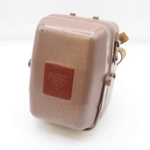 Brown vintage hinged metal case with a closure clamp and a red embossed diamond-shaped emblem on the front.