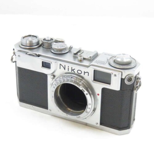Vintage Nikon rangefinder camera with a silver metallic body and black leather grip.