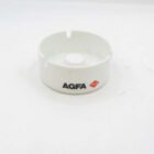White AGFA ashtray with three notches and AGFA logo in black and red on the side.