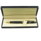 A black and gold pen in an open beige and black case.