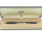 Black and gold pen in a beige velvet-lined Cross case