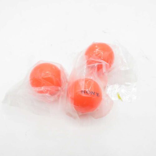 Three orange balls in plastic packaging, one labelled "Sony," on a white background.
