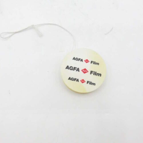 Round plastic tag with a string branding it as "AGFA Film".