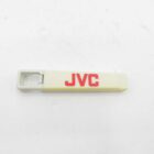 White JVC bottle opener with red lettering on a white background.
