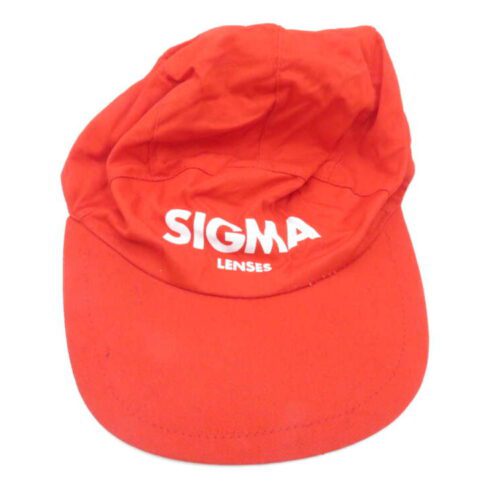 Red cap with "SIGMA LENSES" written in white on the front.