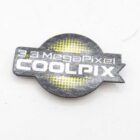 Badge with the text "3.3 MegaPixel COOLPIX" on a black background with a yellow design.