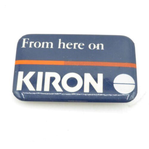 Rectangular badge with rounded corners, featuring the text "From here on KIRON" on a dark blue background with an orange stripe.