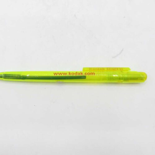 A yellow ballpoint pen with "www.kodak.com" written on the body.