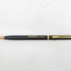 Black and gold pen with "TAMRON LENSES" printed on the side.