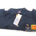 Folded blue polo shirt with "Sydney 2000" Olympics logo and "Kodak" sponsor badge, tag labeled "LINE 7 TEAM AUSTRALIA".