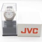 JVC wristwatch in a transparent display case next to a white box with the JVC logo.