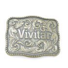 Ornate metal belt buckle with the word "Vivitar" at the centre, surrounded by embossed horse heads and floral patterns.