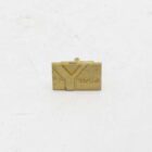 Gold Yashica pin with an embossed "Y" logo and the brand name "Yashica" engraved to the right.