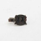 Metal pin badge with the inscription "Patrico Custom Strobo-Lite" and silhouettes of two women.