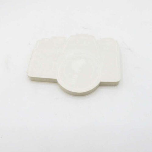 White camera-shaped object on a white background.
