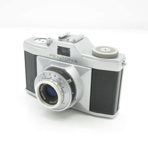 Silver vintage Pentona camera with a black textured grip and prominent lens.