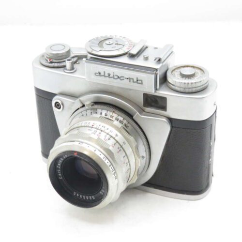 Vintage silver and black rangefinder camera with dials and a lens inscribed with "Crislana."