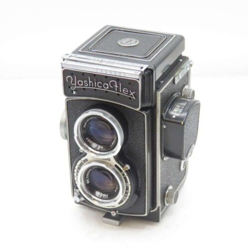 Vintage YashicaFlex twin-lens reflex camera with black and silver design.