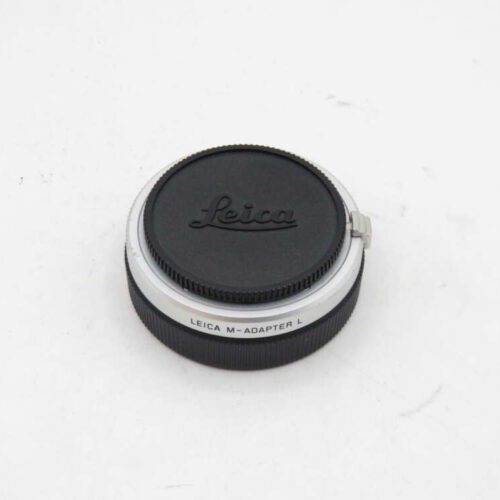 Leica M-Adapter L with lens cap on a white background.