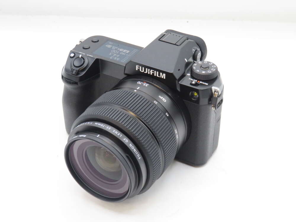 Fujifilm digital camera with a 35-70mm lens.