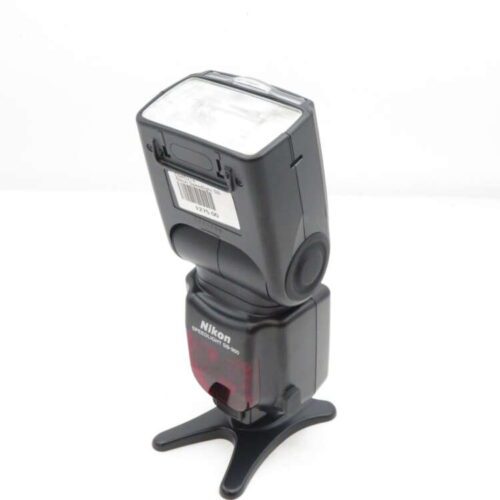 a black camera flash on a stand