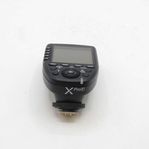 Black Godox XProE camera flash trigger against a white background.