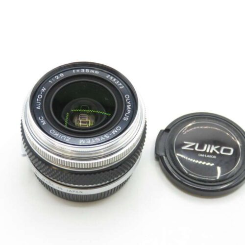 Olympus OM-System Zuiko 35mm f/2.8 camera lens with a detached lens cap.