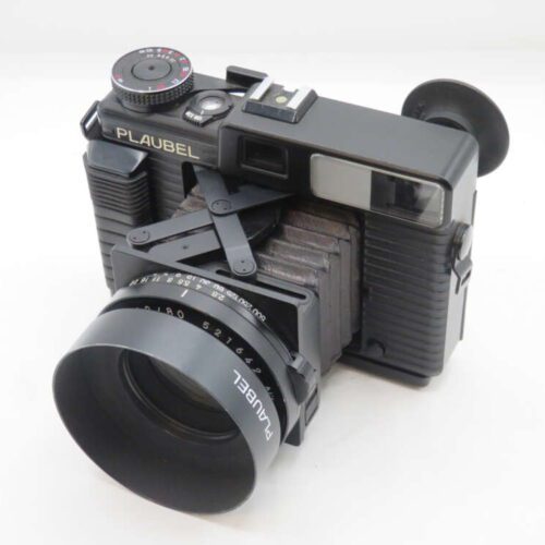 A Plaubel Makina 67 rangefinder camera with a collapsible bellows and a wide lens.