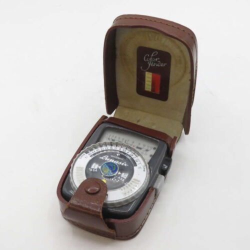 A vintage light meter in a brown leather case with "Color Finder" text inside the lid.