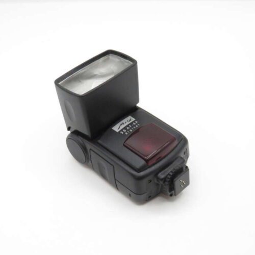 A black external camera flash unit on a white background.