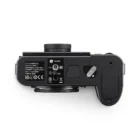 Bottom view of a Leica camera body showing the mount, battery compartment, and identification markings.