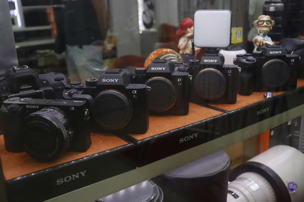 Sony cameras displayed on a shelf in a store.