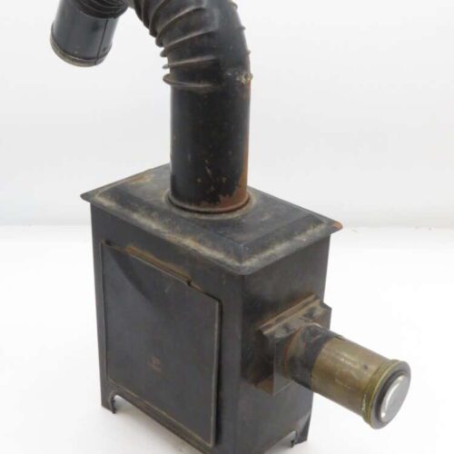 Vintage magic lantern projector with a curved chimney and a brass lens.