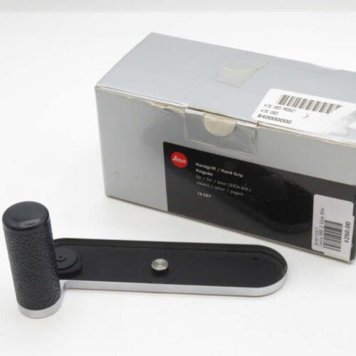 Box and hand grip accessory for Leica M8.2 camera, with a grey and black design.