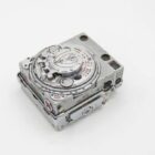 Vintage metal camera rangefinder with dial and distance markings.