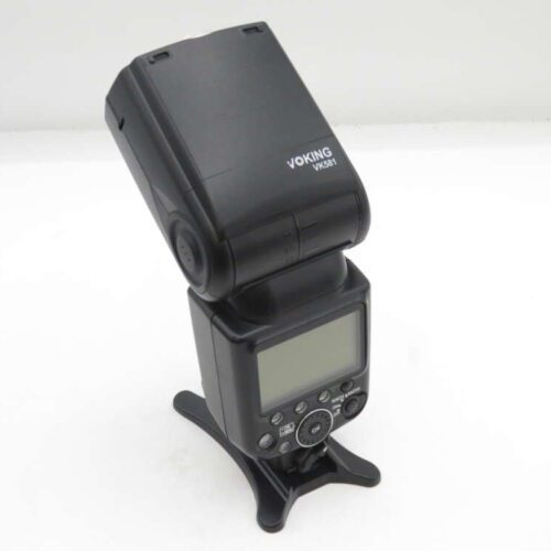 A Voking VK581 camera flash with an adjustable head, featuring a digital display and control buttons on its body, placed on a white surface.