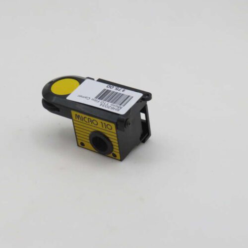 A small black and yellow Micro 110 film camera with a price tag on it, placed on a plain white background.