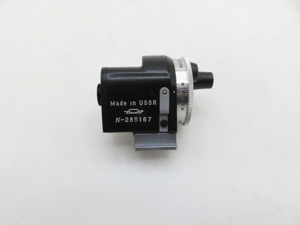 A vintage Made in USSR black optical device with a silver adjustment knob, labelled N-285167, on a white background.